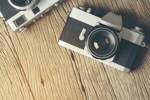 vintage old film camera on wood board photo