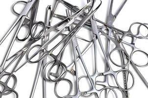 Surgical instruments on white background photo