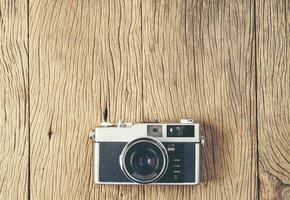 vintage old film camera on wood board photo