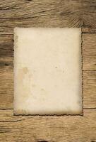 Old paper texture background on wood board photo