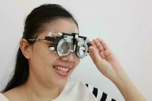 Woman wearing eyeglass on the grey background photo