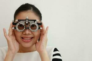 Woman wearing eyeglass on the grey background photo