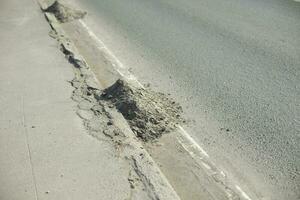 Dirt on road. Dust at curb. Asphalt cleaning. photo