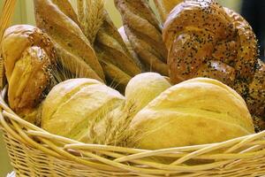 Assortment of fresh baked fragrant artisan bread. Food concept. The healthy eating and traditional bakery. Homebaked sourdough production with crispy crust photo