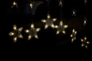 Star garlands. Decoration for new year. Garlands on Christmas tree. photo