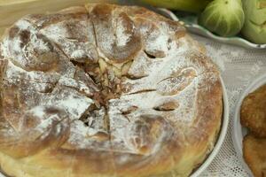 Apple pie. Delicious food. Flour pastries on table. Grandma's pie. photo