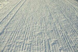 Ski track in winter. Place for winter sports. Prepared ski slope. photo