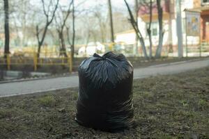 Garbage bag. Black Waste Bag. Plastic bag. photo