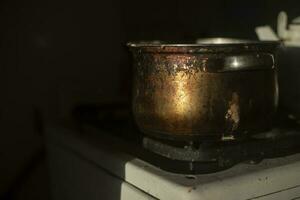 Rusty pot in kitchen. Old dishes. Kitchen details. photo