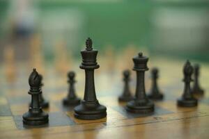 Chess pieces on table. Chess Tournament. Ancient Strategy. photo