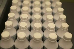 White bottles. Yogurt bottles. Drinks in store. photo