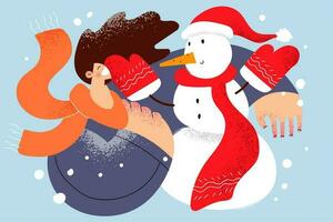 Enjoying wintertime and snow concept. Young smiling cheerful woman in scarf playing with snowman and enjoying being on nature outdoors and winter holidays celebration vector illustration