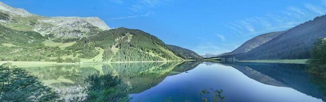 Panoramic view over Vilsalpsee lake in Tannheimer Tal valley, Austria photo