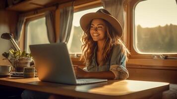 Happy Mixed-Race Young Adult Female Enjoying Working Remotely Inside Her RV Camper Trailer - . photo