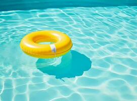 A blue bottom swimming pool with blue water below a large yellow rafting in the mid photo