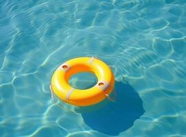 A blue bottom swimming pool with blue water below a large yellow rafting in the mid photo