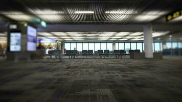 Passengers in the waiting area at the airport with a service shop inside the boarding gate. video