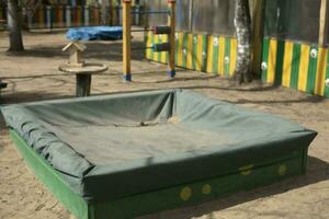 Sandbox for children. Outdoor play area. Place for children to play in sand. photo