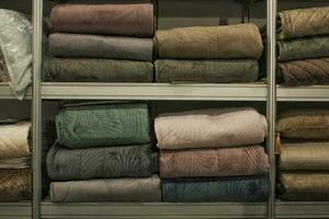 Stack of fresh towel on the shelf. Bath household organizer domestic spa textile equipment storage. Beauty body care hygiene procedure at bathroom. Shelving unit in home photo