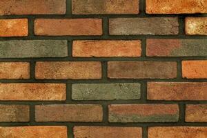 Decorative granite cobble stone tile brick wall texture background. Seamless pattern backdrop. Crafted modern brickwork outer wall. House exterior with sandstone blocks tiled photo