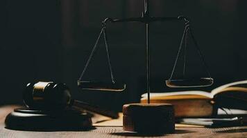 Justice and law concept.Male judge in a courtroom with the gavel, working with, computer and docking keyboard, eyeglasses, on table in morning light video