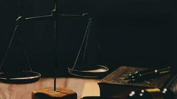 Justice and law concept.Male judge in a courtroom with the gavel, working with, computer and docking keyboard, eyeglasses, on table in morning light video