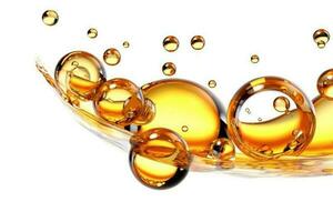 Golden yellow abstract oil bubbles or face serum isolated on white background. photo