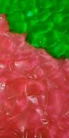 Green and red colored fruit jelly photo