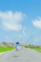 image of the road and wind turbines on Phu Quy island in Vietnam photo