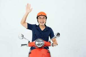 a man wearing a helmet and driving a motorcycle photo