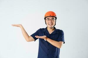 man wearing orange helmet on white background photo