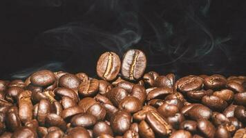 Coffee beans roasted on a black background with copy space for your text photo