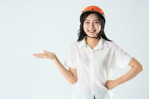 woman wearing orange helmet on white background photo