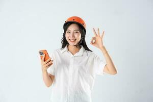 woman wearing orange helmet on white background photo