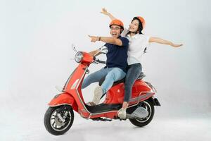 image of asian couple riding scooter on white background photo