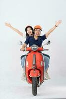 image of asian couple riding scooter on white background photo