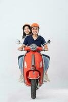 image of asian couple riding scooter on white background photo