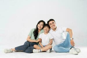 a family posing on a white background photo