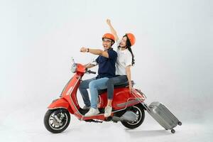 image of asian couple riding scooter on white background photo