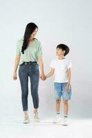 mother and son posing on a white background photo