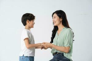 mother and son posing on a white background photo