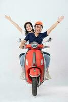 image of asian couple riding scooter on white background photo