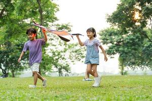 group image of cute asian children playing in the park photo