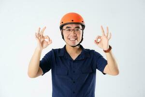 man wearing orange helmet on white background photo