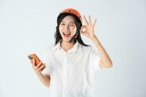 woman wearing orange helmet on white background photo