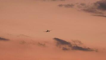 Commercial jet airplane departure, fly away at sunset. Airplane in flight. Tourism and travel concept video