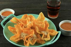 Batagor, Indonesian Speciality Fried Dumpling Served with Spicy Peanut Sauce photo