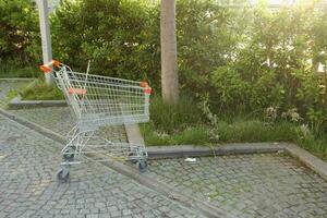 Shopping cart in a empty car park photo