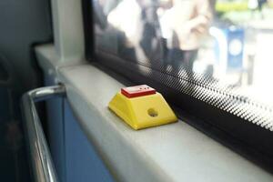 Closeup of Bus bell switch for stop inside the public bus photo