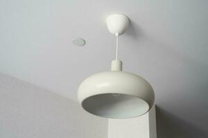 gray ceiling lamp hanging in a room , photo